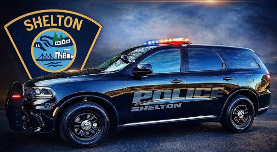 Shelton Police Cruiser with Badge in background